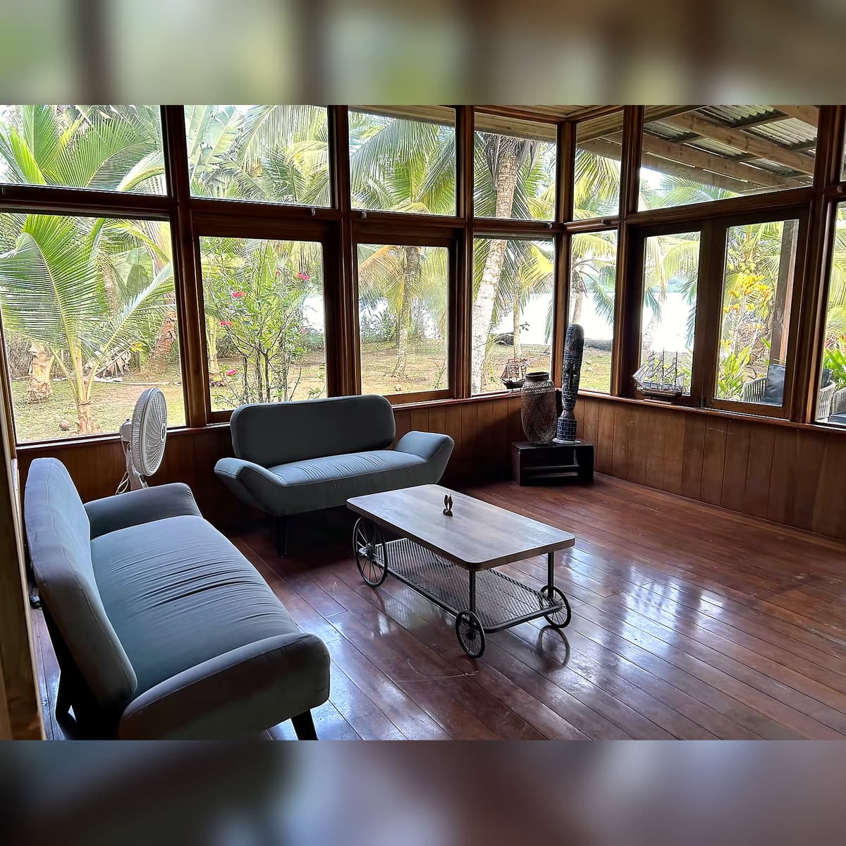 Salon Azul interior relaxation space at Dolphin Blue Paradise, Bocas del Toro - serene space for reading, meditation, and board games